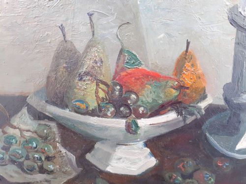 fig 2. A mid-century French modernist oil painting on canvas depicting a ceramic bowl with pears, bunches of grapes, and a candlestick on a table against a textured grey background.