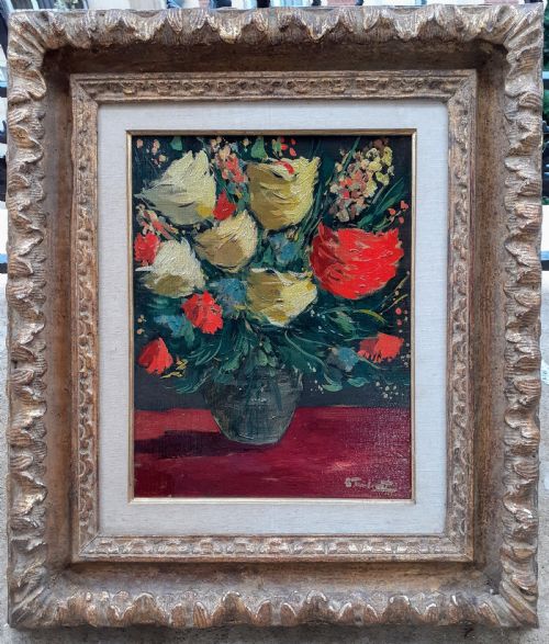 fig 2. A framed oil painting on canvas depicting a bouquet of yellow and red flowers in a glass vase set on a dark red table surface.