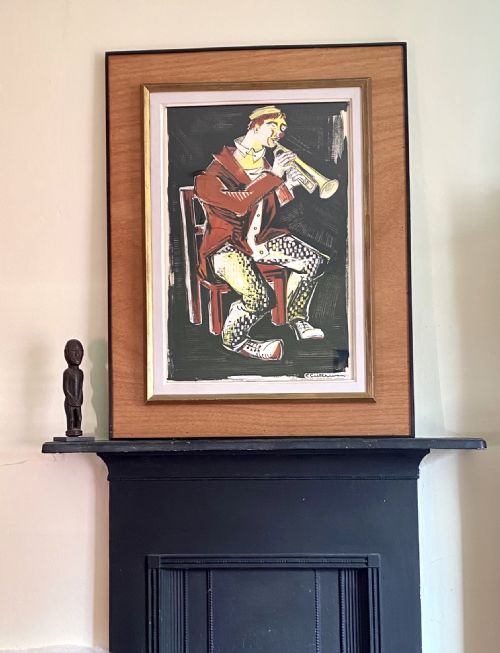 fig 3. A mid-century gouache painting on paper illustrating a clown in a red jacket and patterned trousers seated on a chair while playing a golden trumpet.