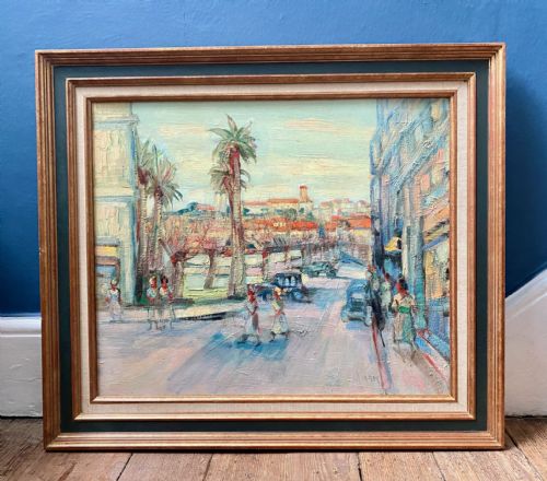 fig 1. A mid-century French colourist oil painting depicting a sunlit Mediterranean street scene with palm trees, buildings, and figures.