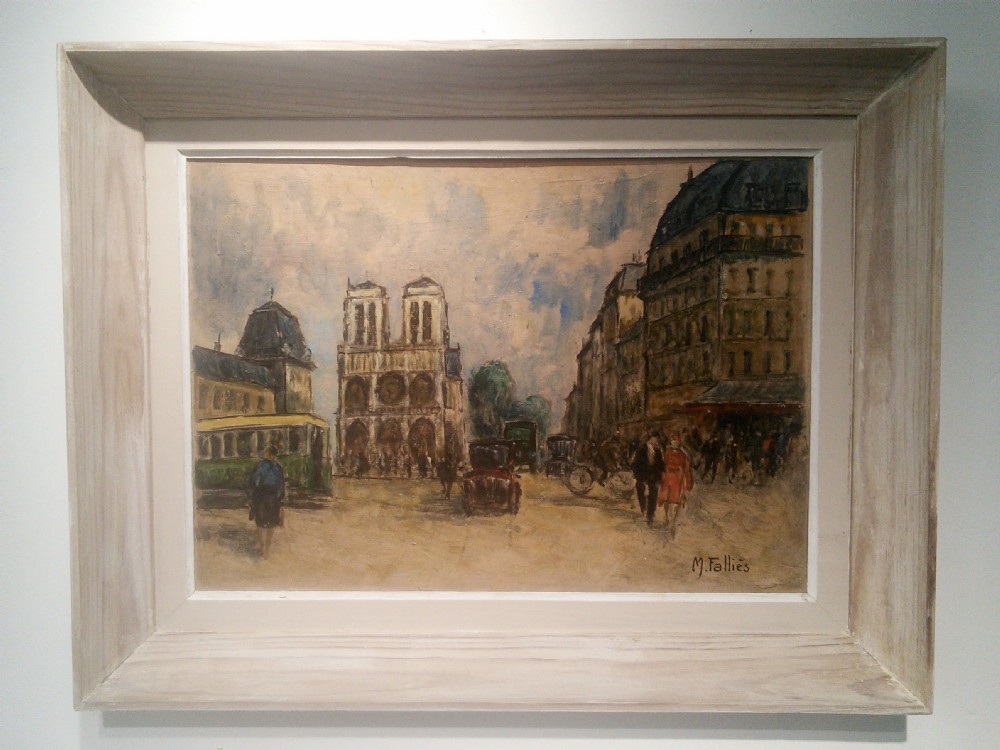 A framed oil painting depicting a Parisian street scene with Notre Dame Cathedral in the background under a cloudy sky.