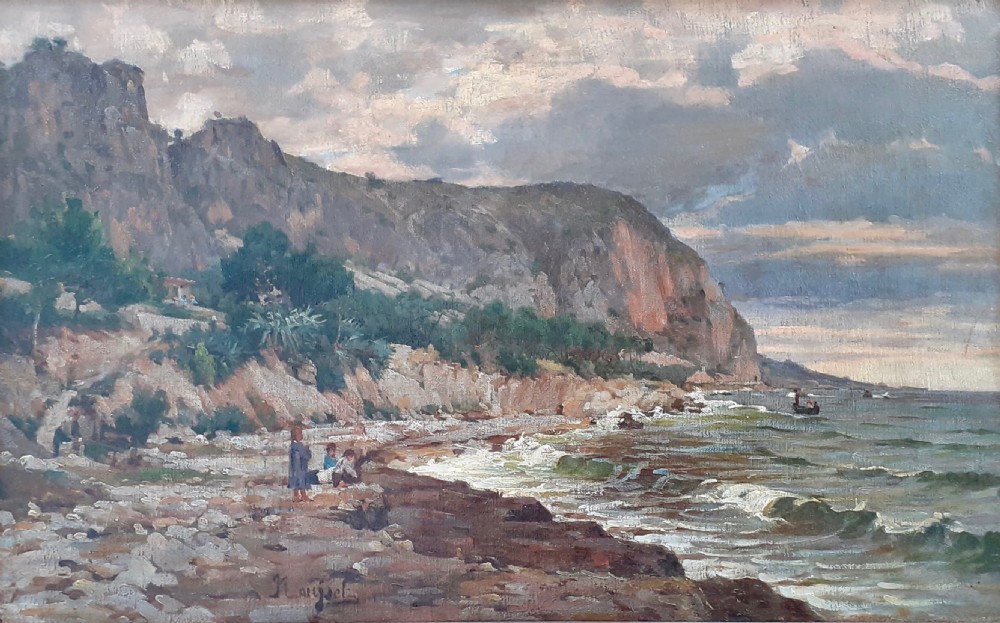 An antique oil painting on canvas depicting a coastal landscape in the South of France with figures on a stony shore beside cliffs under an evening sky.