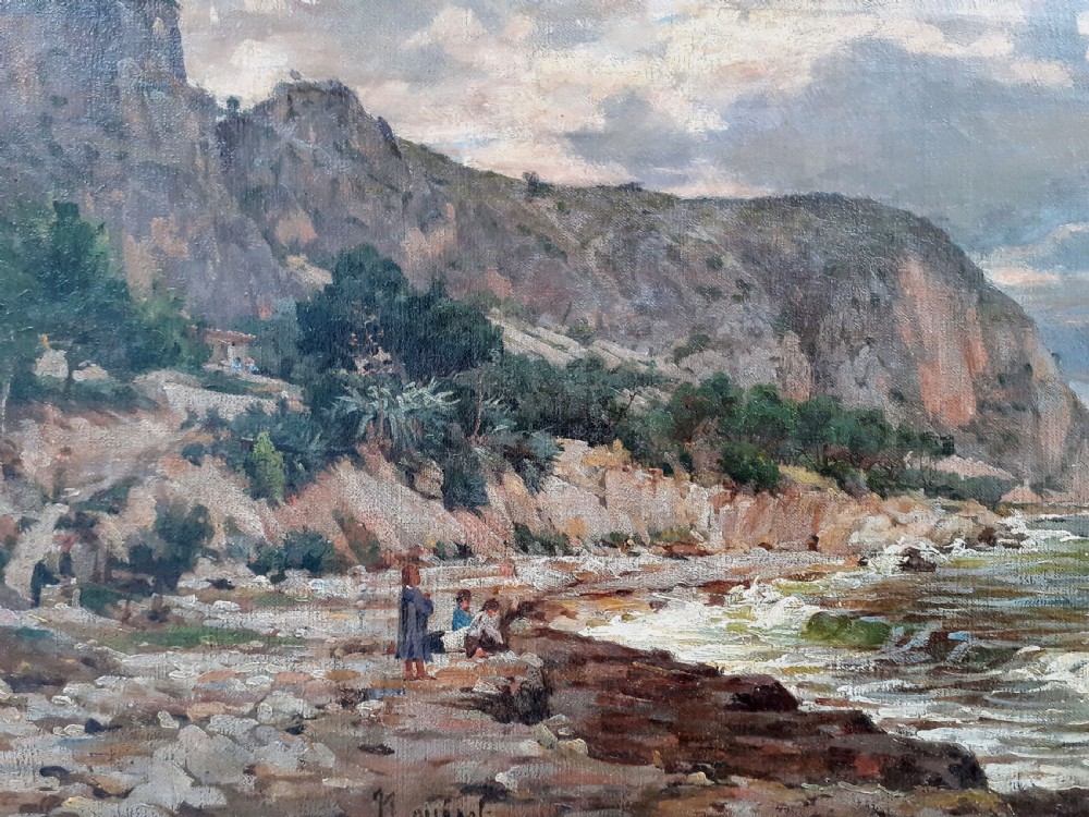 An antique oil painting on canvas depicting a coastal landscape in the South of France with figures on a stony shore beside cliffs under an evening sky. View III