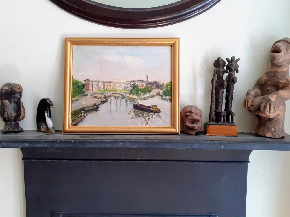 A French Post-Impressionist oil painting on board depicting barges on the River Seine with Parisian architecture in the background. View V