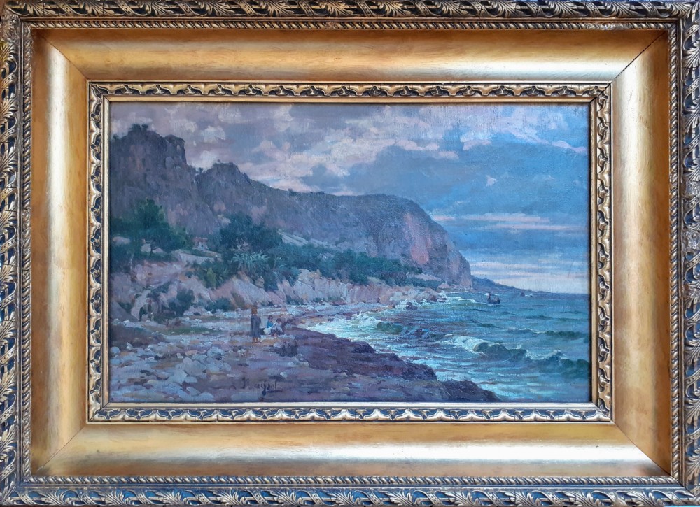 An antique oil painting on canvas depicting a coastal landscape in the South of France with figures on a stony shore beside cliffs under an evening sky. View II