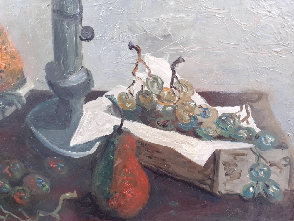 A mid-century French modernist oil painting on canvas depicting a ceramic bowl with pears, bunches of grapes, and a candlestick on a table against a textured grey background. View IV