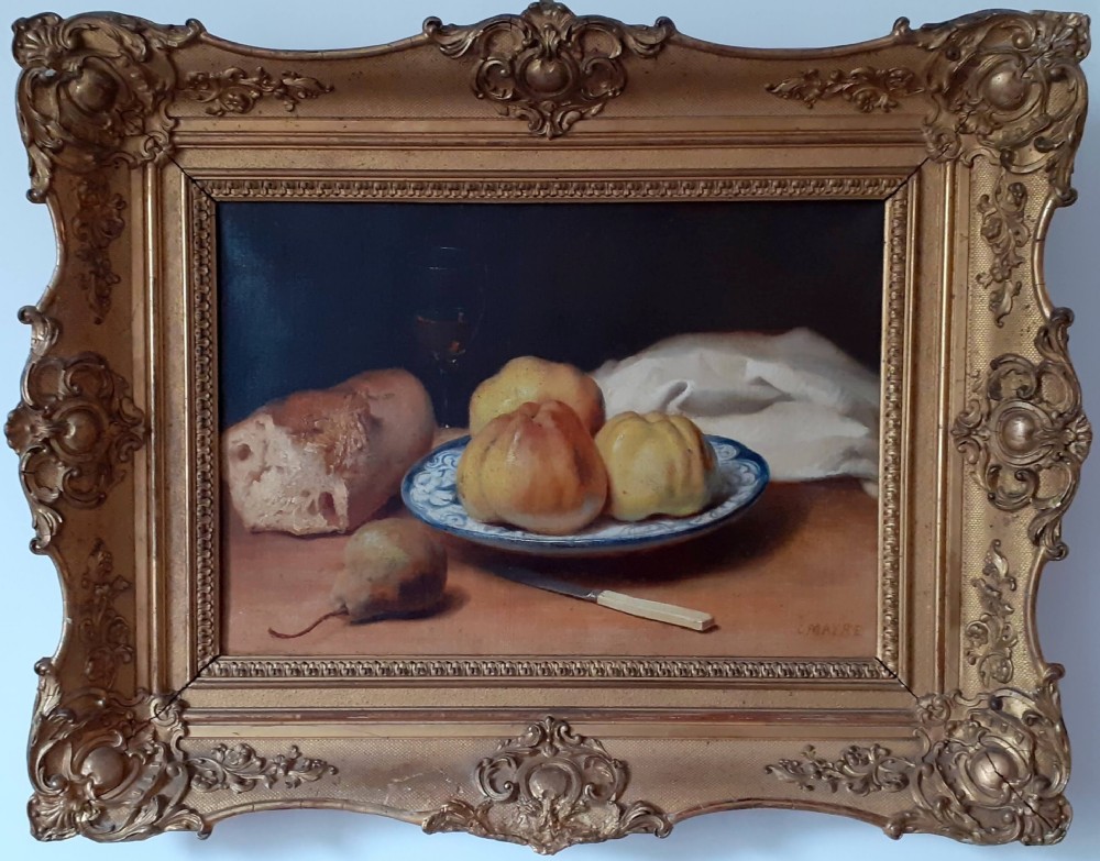 A mid-19th-century oil painting on canvas depicting a rustic still life with bread, fruit on a ceramic plate, a pear, and a knife, housed in an ornate carved gold frame.