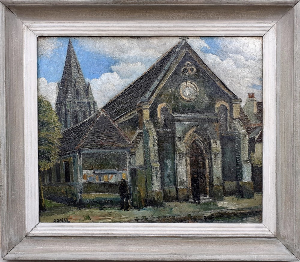 An oil painting on canvas depicting a Gothic stone church with a steeple under a cloudy sky, presented in a light grey wooden frame.