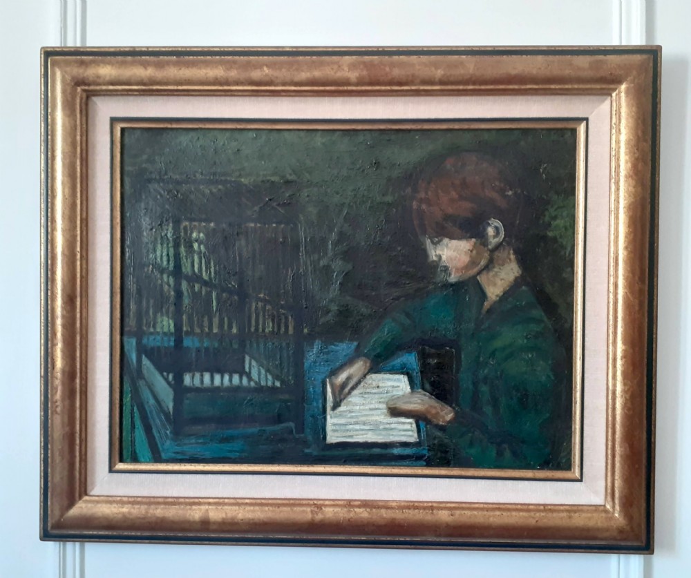 An oil painting on canvas depicting a child seated at a blue table beside a dark birdcage, painted in dark green and blue tones. View V