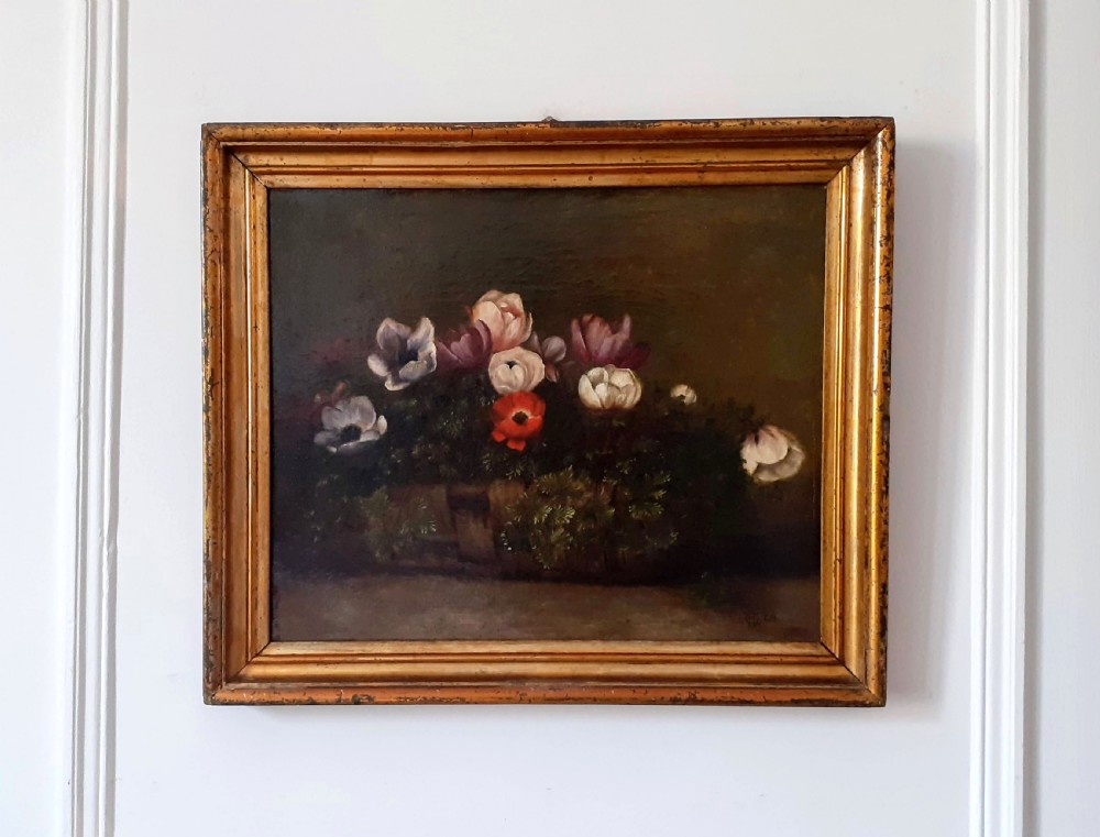 A 19th-century oil painting depicting colourful anemone flowers arranged inside a woven wicker basket against a dark background. View III