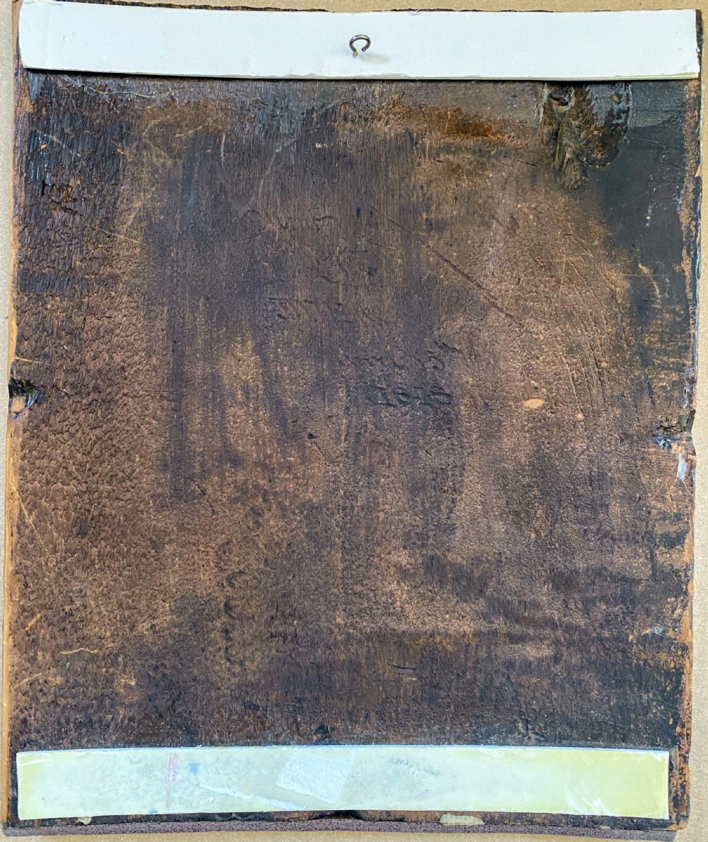 An antique rectangular wooden panel featuring a pyrography pokerwork profile portrait of a bearded man holding a book. View IV