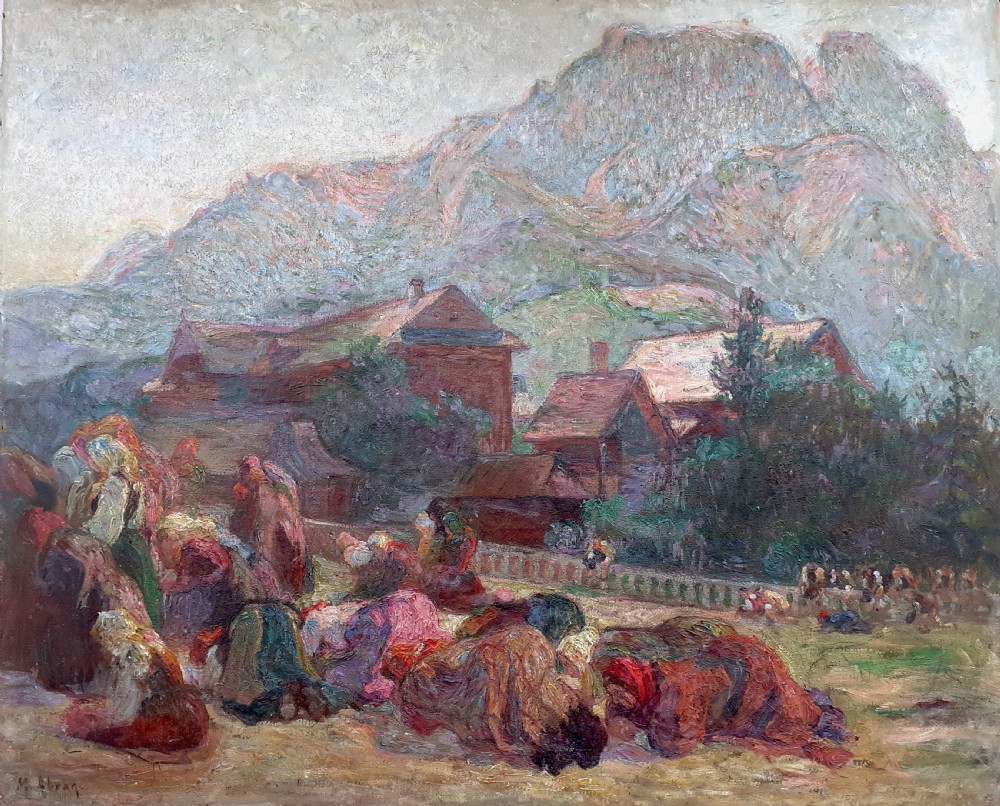 An early 20th-century oil painting on canvas featuring figures in traditional dress kneeling in prayer near wooden village houses beneath a towering mountain peak.
