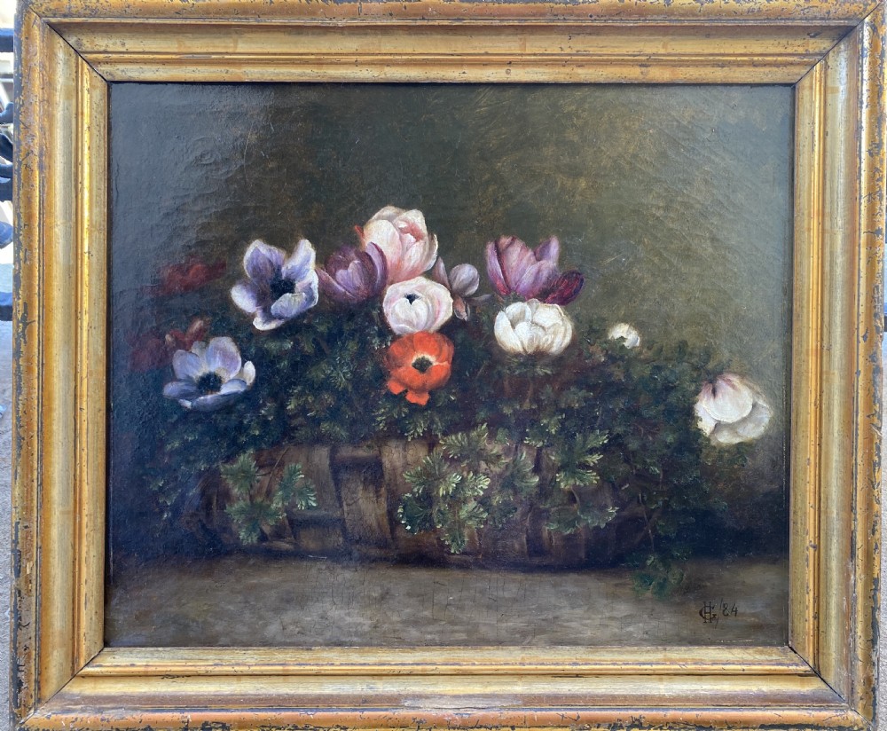 A 19th-century oil painting depicting colourful anemone flowers arranged inside a woven wicker basket against a dark background. View VI