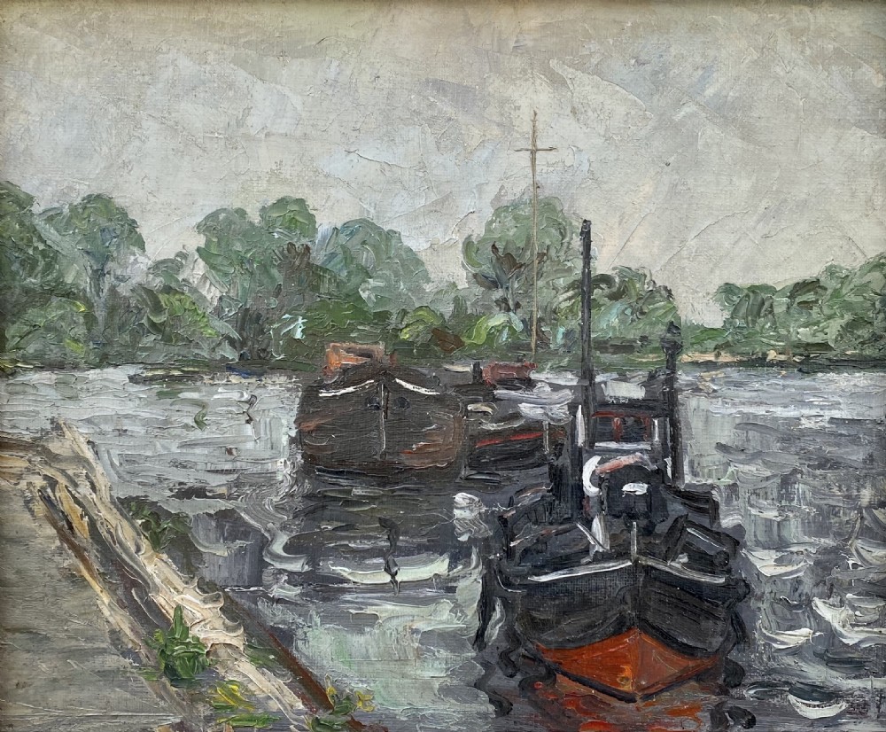 An oil on canvas painting featuring dark wooden barges docked along a riverbank with trees in the background.