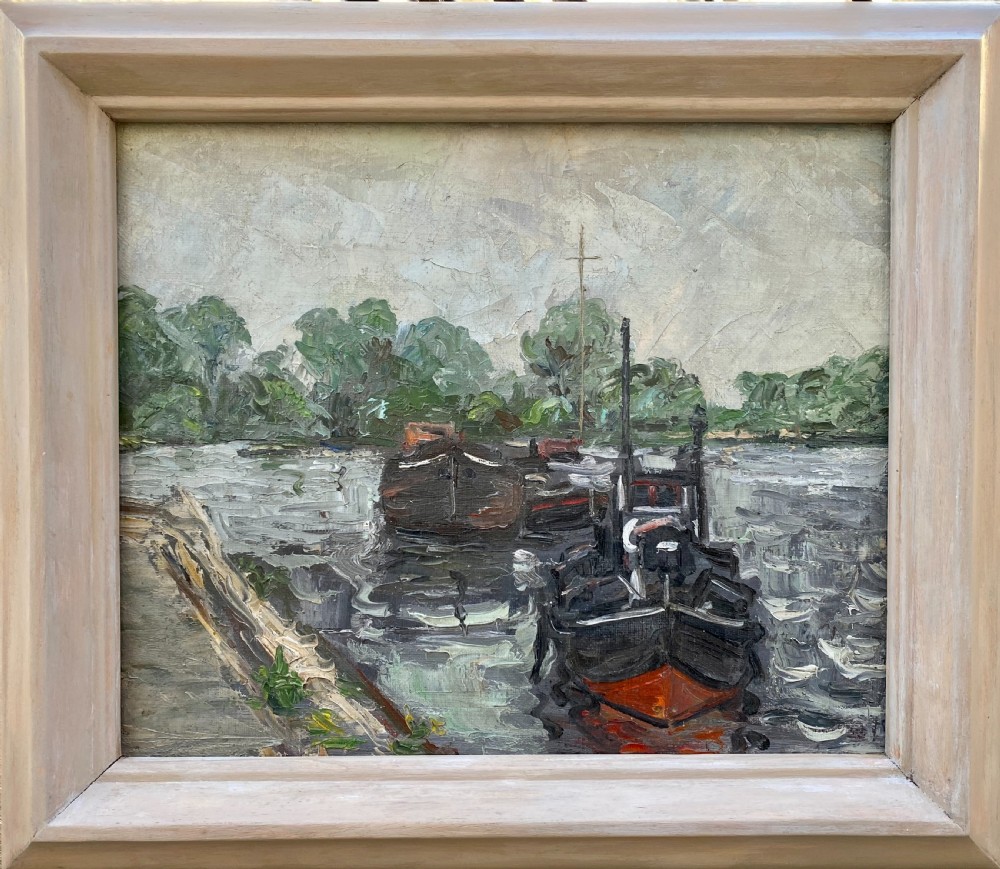 An oil on canvas painting featuring dark wooden barges docked along a riverbank with trees in the background. View II