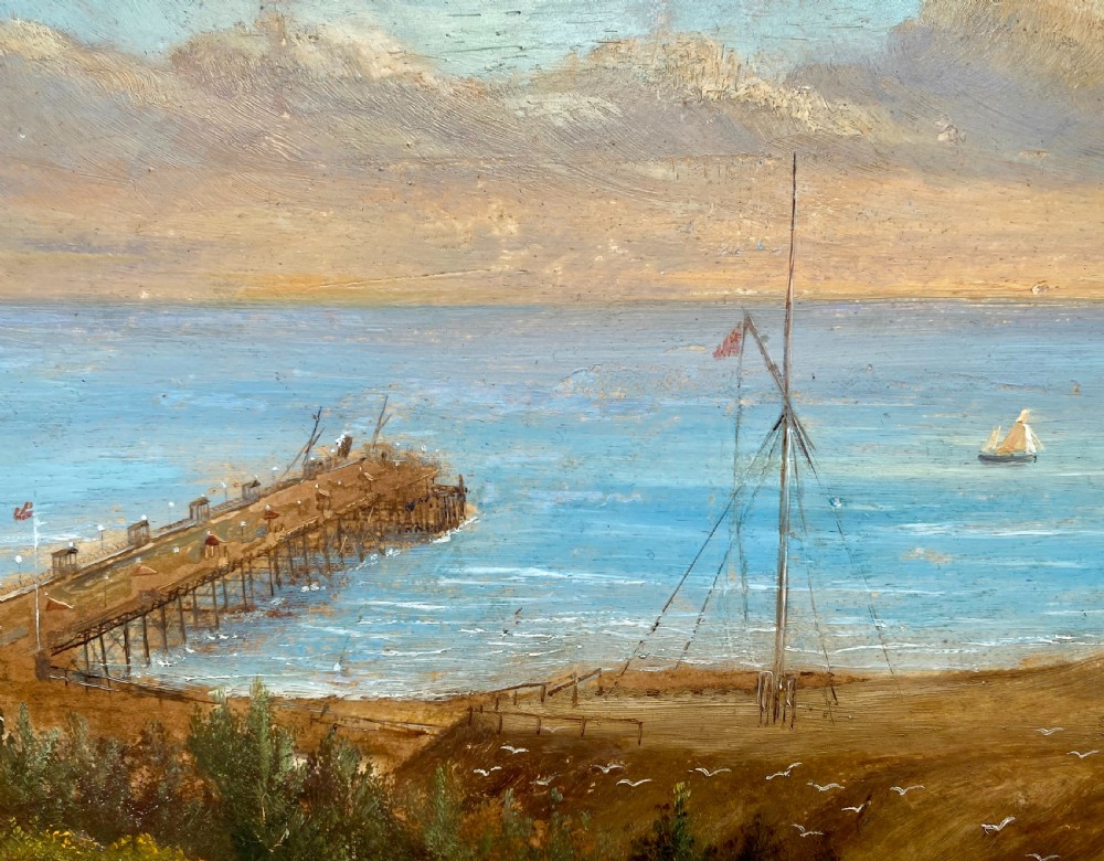 Victorian topographical oil painting on board depicting Boscombe Pier in Dorset with steamships on blue water and coastal cliffs in the foreground. View IV