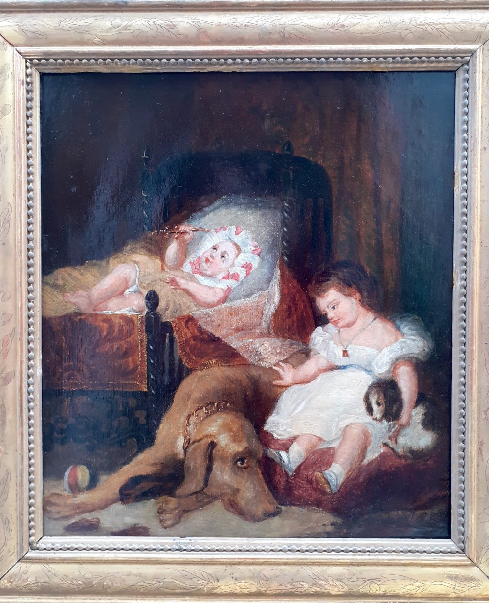 An early nineteenth-century oil painting depicting two young children, a large dog, and a small puppy inside a dimly lit interior. View V