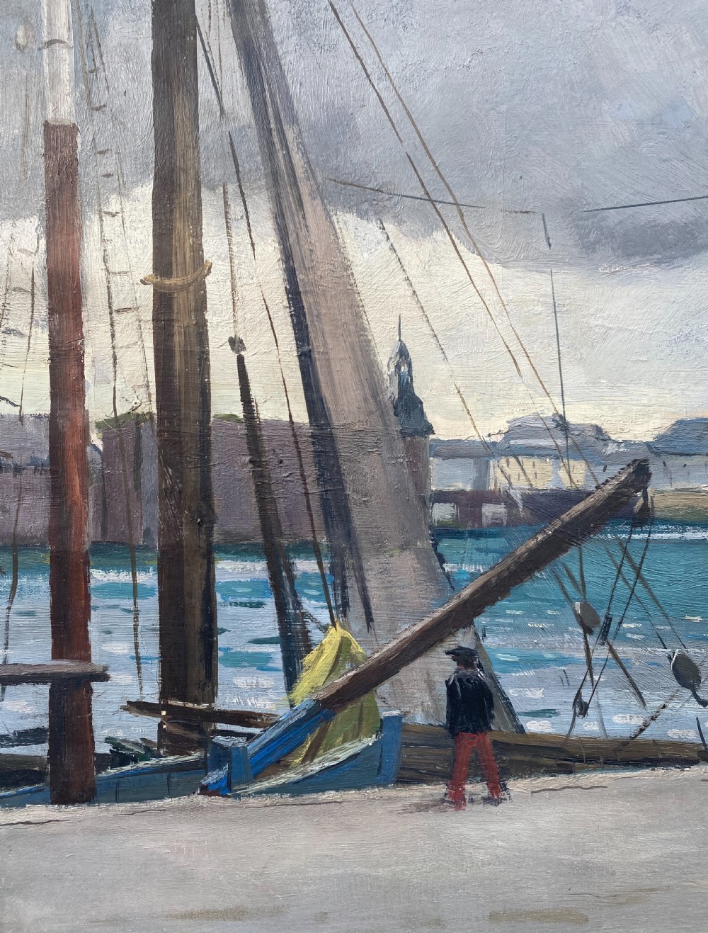 An oil painting on canvas depicting figures walking along a grey stone quay beside sailing vessels in a Brittany harbour under an overcast sky. View VI