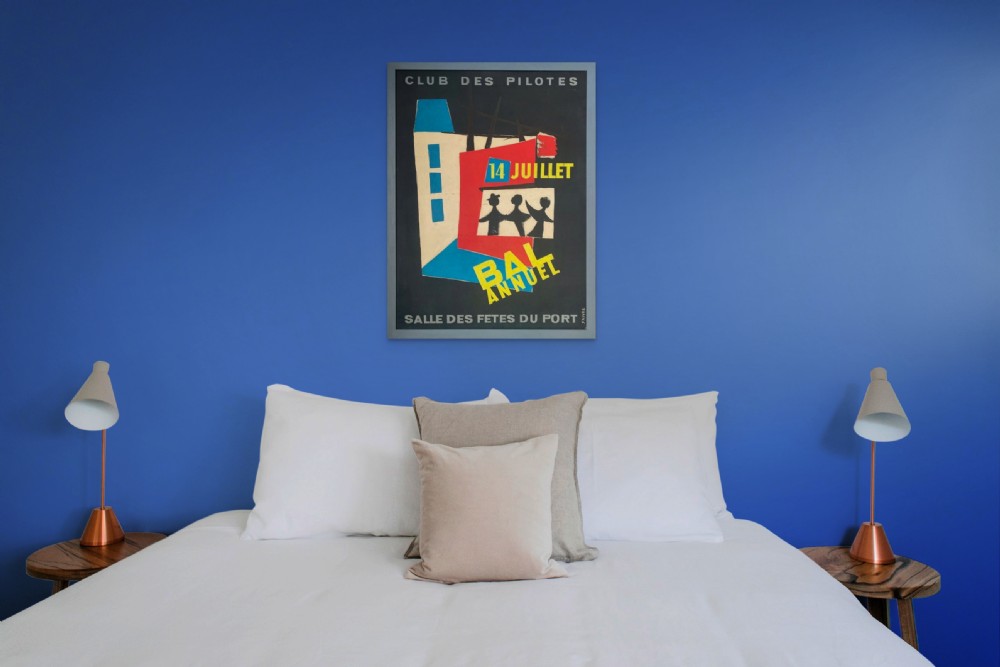 A mid-century graphic poster design painted in gouache on paper featuring abstract figures, geometric buildings, and French lettering over a navy blue background. View VII