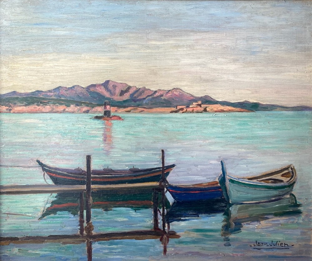 An oil painting on a wooden panel depicting small wooden boats moored at a jetty along a calm Mediterranean coastline with mountains in the background.
