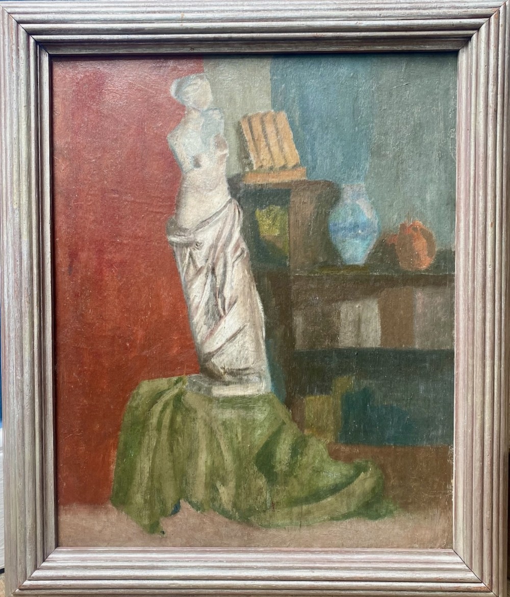 A framed oil painting on board depicting a classical draped torso sculpture set against a split red and blue interior background.