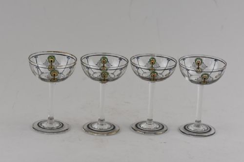 A SET OF 4 ART DECO STEINSCHONAU ENAMELLED SMALL DRINKING GLASSES