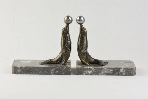 A PAIR OF ART DECO SEALION BOOKENDS