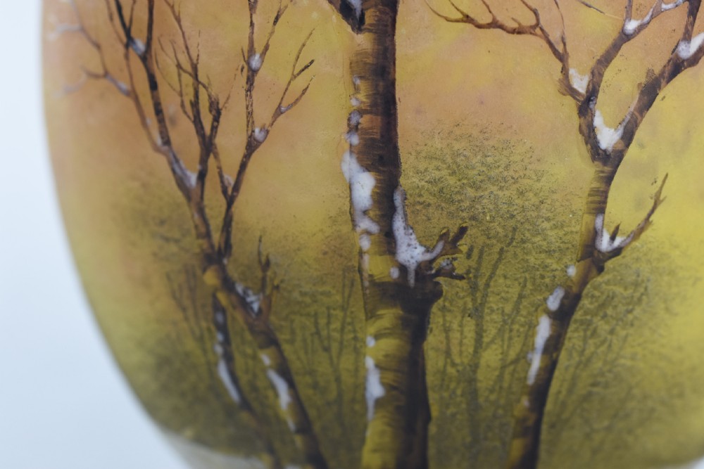 An Art Nouveau Daum Nancy glass jug featuring acid-etched and enamelled winter landscape decoration on an orange gradient background, complete with a spherical stopper. View VI