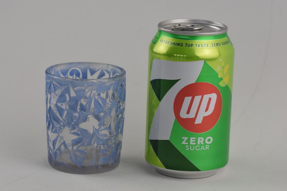 A small cylindrical clear and frosted glass vessel decorated with an embossed ivy motif highlighted with blue stain. View VIII