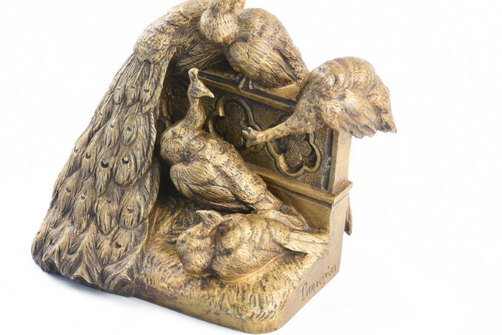 A French Art Nouveau patinated bronze sculpture depicting five peacocks perched around a carved balustrade. View VI