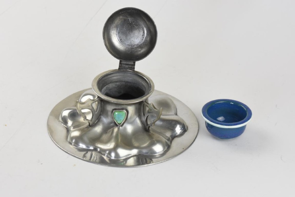 A polished pewter Arts and Crafts inkwell featuring a flared lobed base, stylized handles, and two inset turquoise ceramic cabochons. View III
