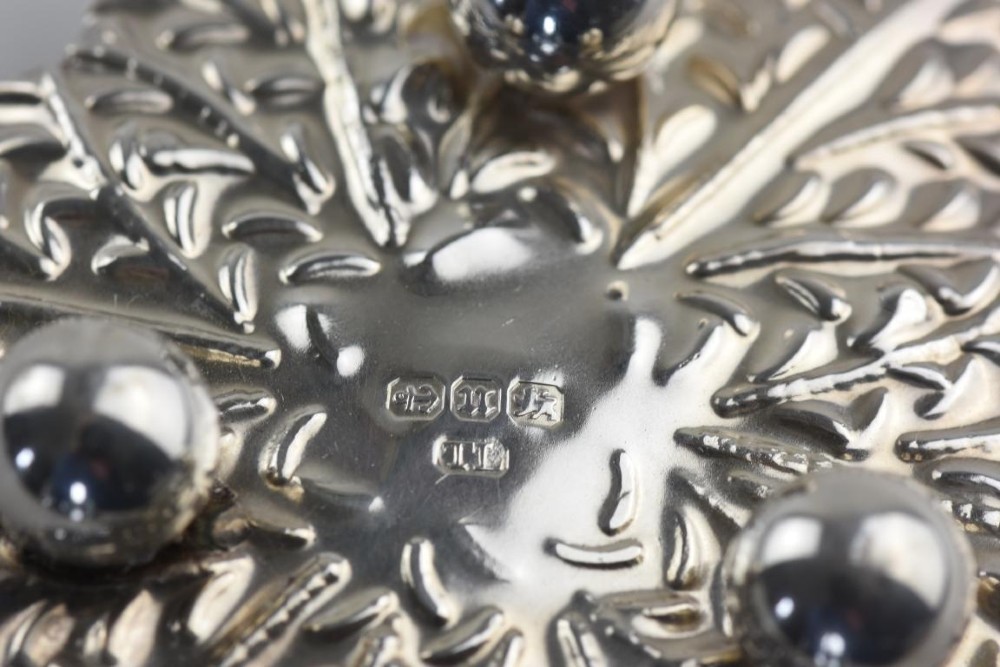 A pair of Aesthetic Period silver salt cellars with leaf-shaped bases, clear glass lotus liners, matching silver spoons, housed in a fitted velvet presentation case. View V
