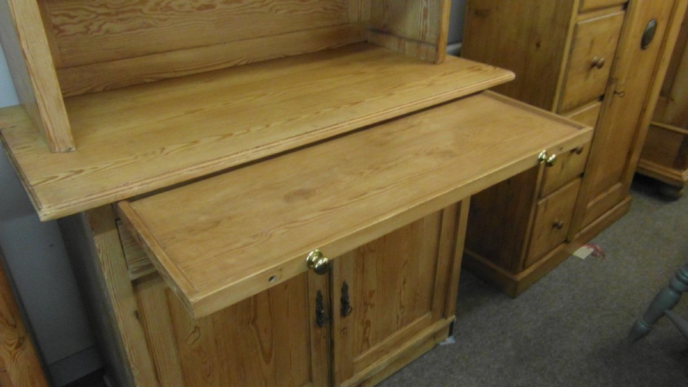 A Victorian pine kitchen dresser featuring an upper two-door cabinet with pleated fabric panels over a base unit with two drawers and two cupboard doors. View II