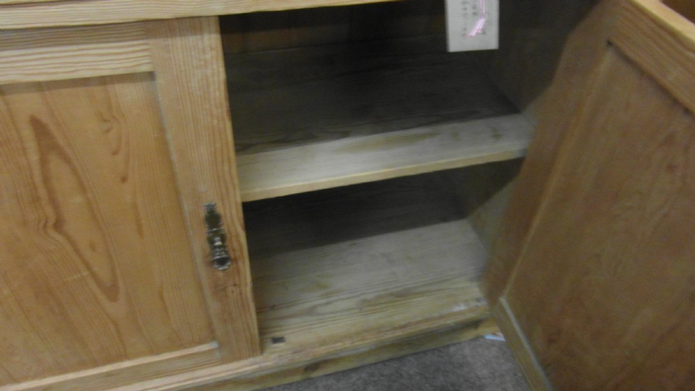 A Victorian pine kitchen dresser featuring an upper two-door cabinet with pleated fabric panels over a base unit with two drawers and two cupboard doors. View VI