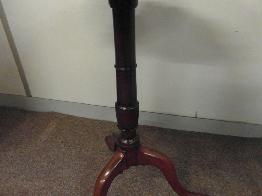 A circular dark mahogany side table featuring a carved pie-crust scalloped top supported on a turned central column and three cabriole tripod legs. View III