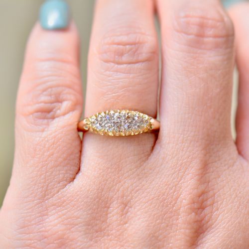 fig 2. A Victorian gold ring featuring a boat-shaped setting set with two rows of old mine cut diamonds.