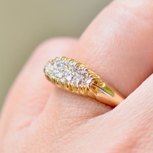 fig 3. A Victorian gold ring featuring a boat-shaped setting set with two rows of old mine cut diamonds.