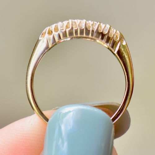 fig 6. A Victorian gold ring featuring a boat-shaped setting set with two rows of old mine cut diamonds.