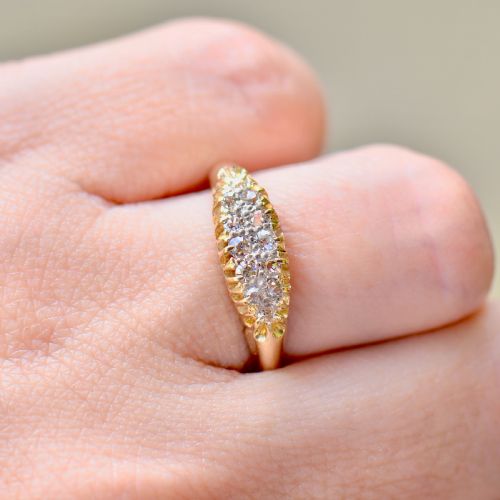 fig 7. A Victorian gold ring featuring a boat-shaped setting set with two rows of old mine cut diamonds.
