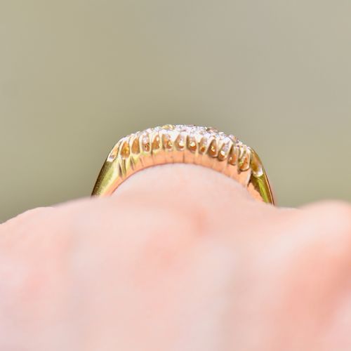 fig 8. A Victorian gold ring featuring a boat-shaped setting set with two rows of old mine cut diamonds.