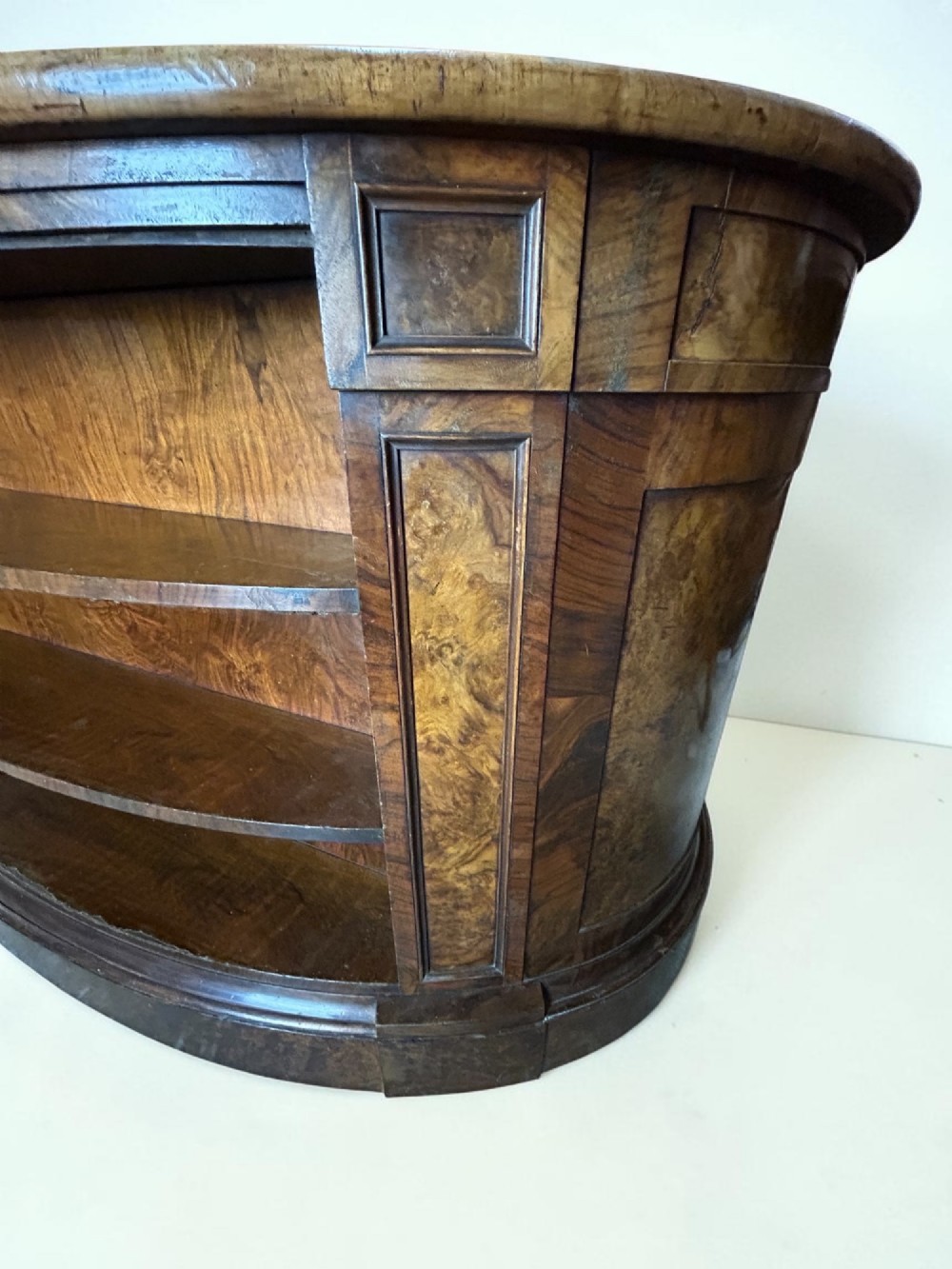 A 19th-century freestanding kidney-shaped desk crafted from warm brown burr walnut with a dark leather inset top and dual drawer pedestals. View VIII