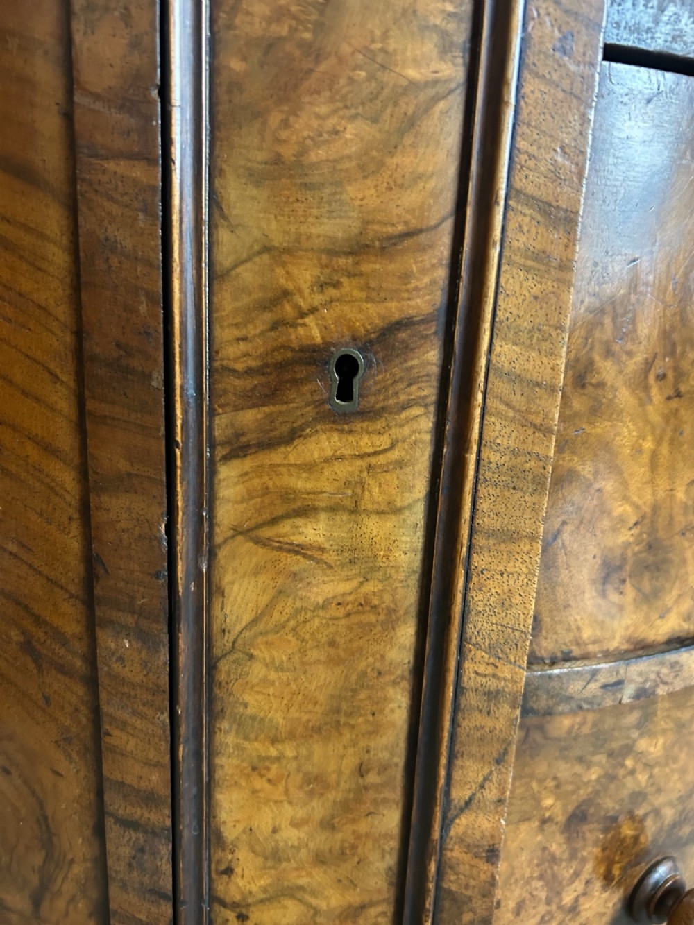 A 19th-century freestanding kidney-shaped desk crafted from warm brown burr walnut with a dark leather inset top and dual drawer pedestals. View IX