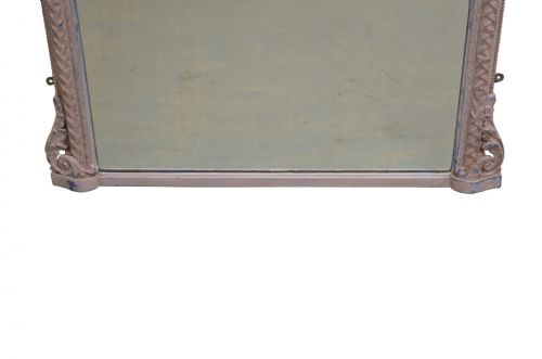 An arched French overmantel mirror featuring a carved wooden frame with a layered lilac and blue painted finish. View IV