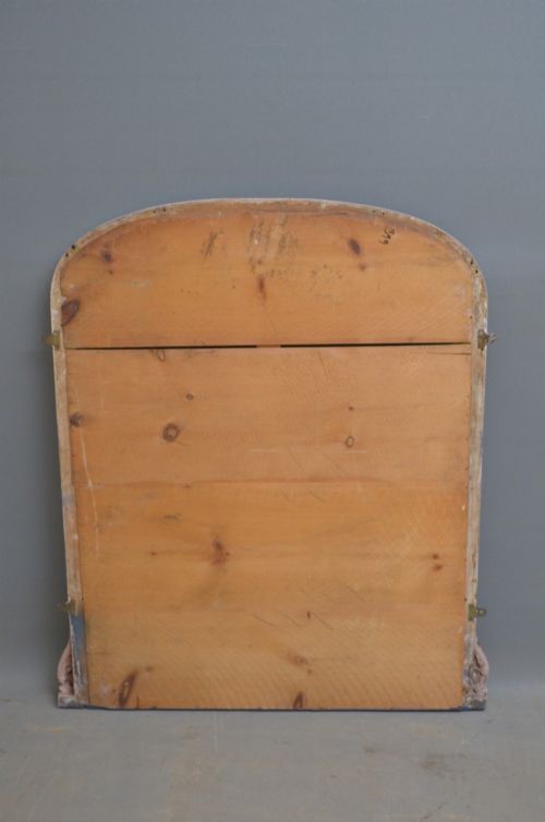 An arched French overmantel mirror featuring a carved wooden frame with a layered lilac and blue painted finish. View V