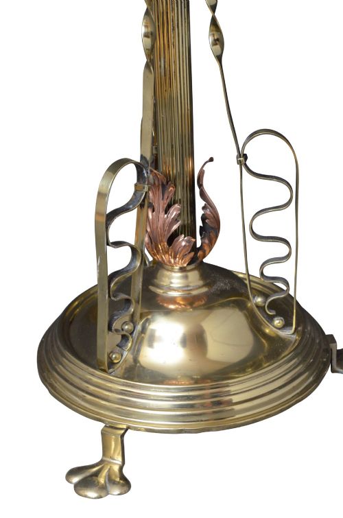 An Art Nouveau brass and copper standard lamp with a telescopic stem, scrolled metal base, and flared cream fabric shade. View IX