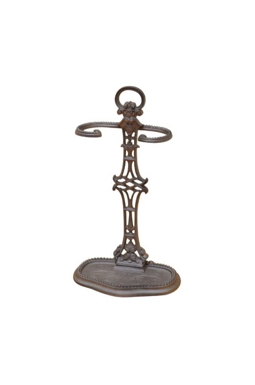 fig 1. A dark cast iron French Art Nouveau umbrella stand featuring an openwork central column, loop handle, retention rings, and a beaded drip tray base.