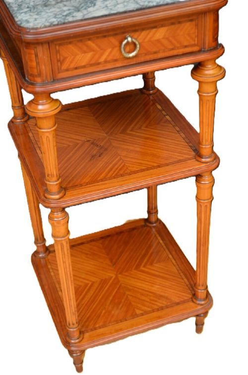 A pair of antique satinwood bedside cabinets with green marble tops, fluted turned legs, and decorative parquetry wood inlays. View XII