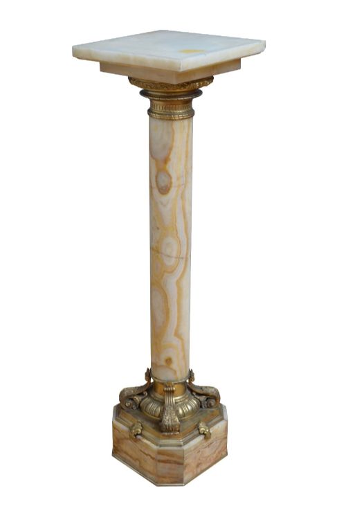fig 2. A pair of tall cylindrical onyx marble pedestals with square top plinths and ornate gilt ormolu collars and bases.