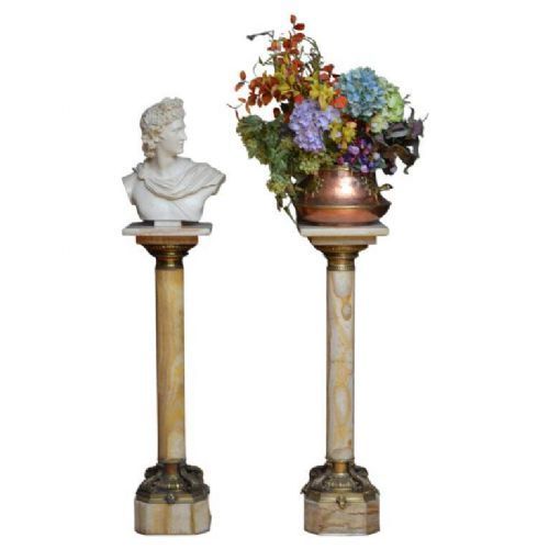 fig 1. A pair of tall cylindrical onyx marble pedestals with square top plinths and ornate gilt ormolu collars and bases.