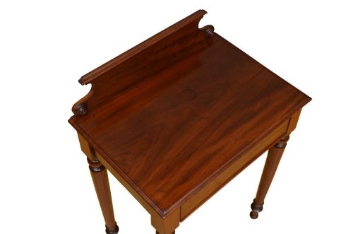 fig 4. A narrow antique mahogany console table featuring turned legs and a polished timber top against a plain white background.